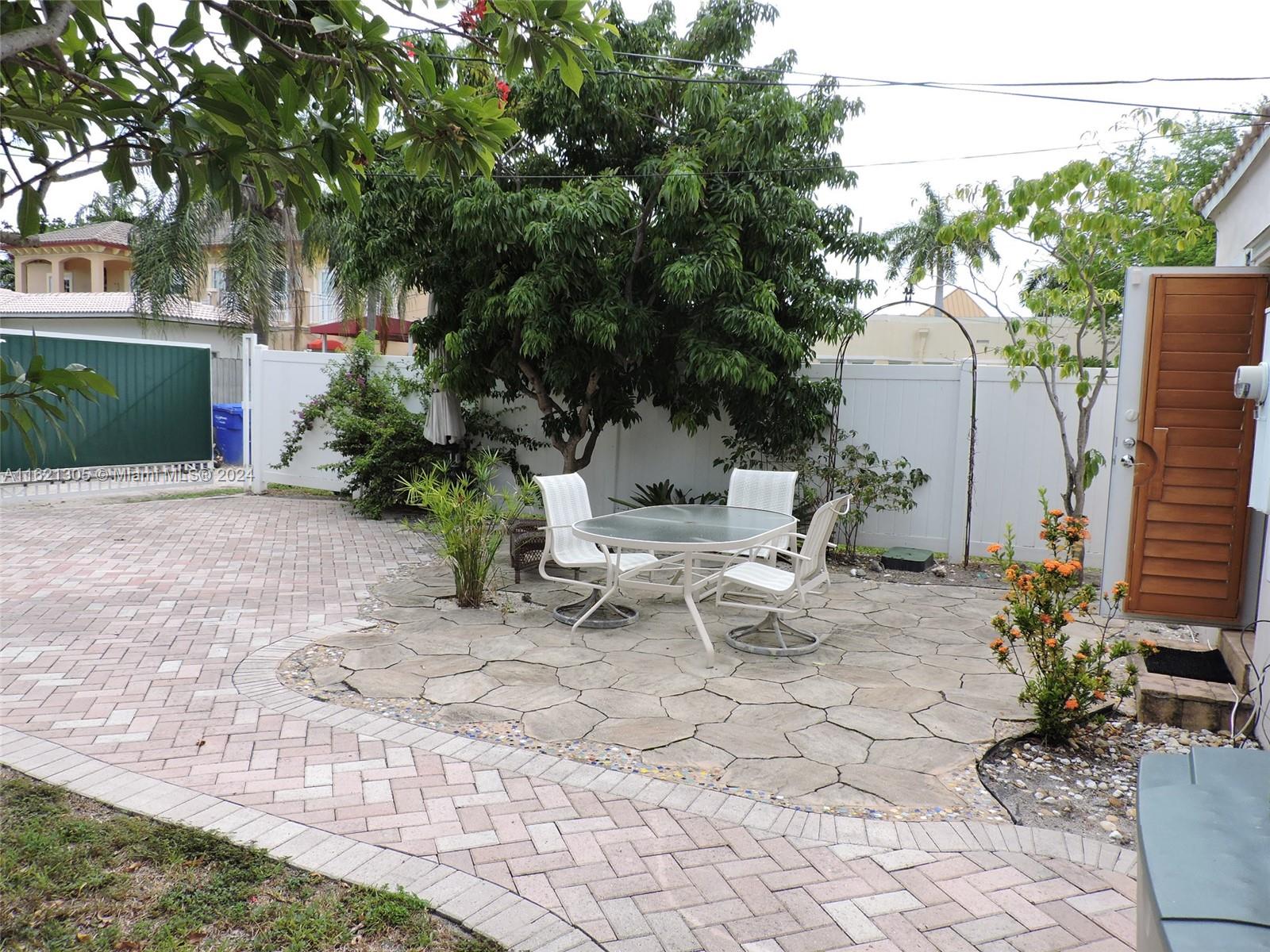 1630 Tyler Street Hollywood, FL 33020 - Photo 19 of 26 a view of a backyard with sitting area