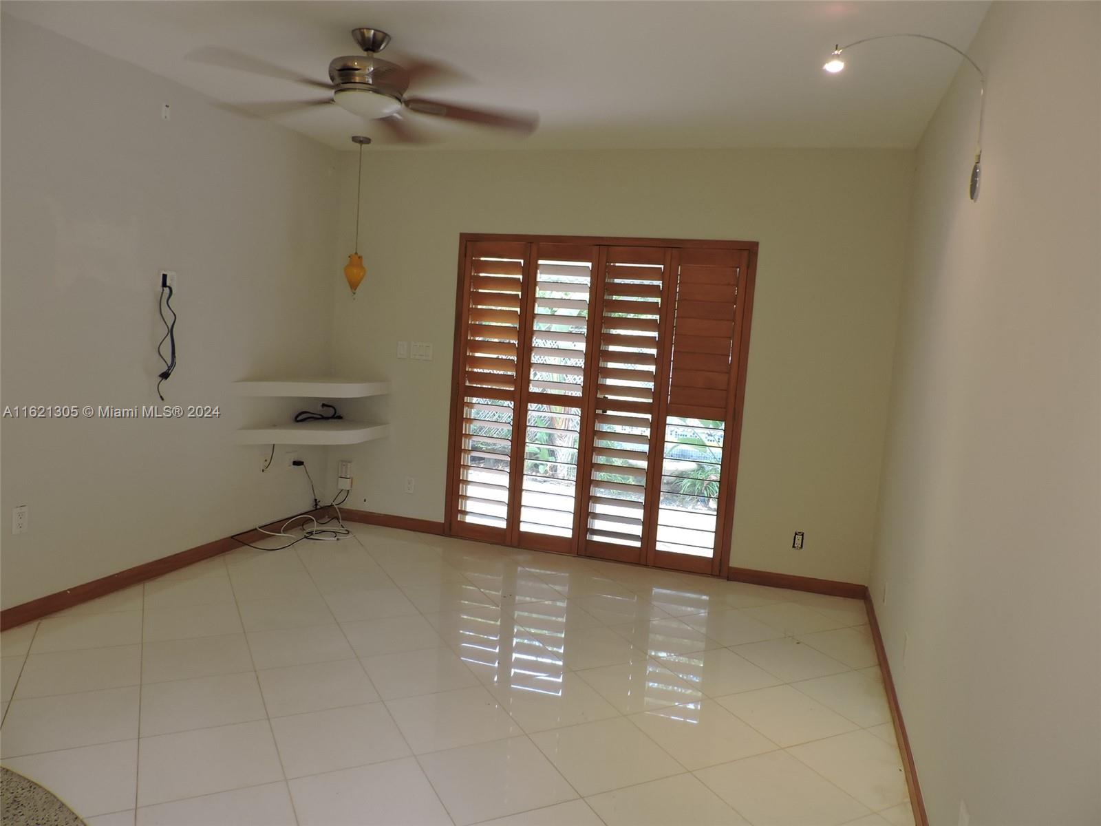 1630 Tyler Street Hollywood, FL 33020 - Photo 20 of 26 a view of an empty room with a window