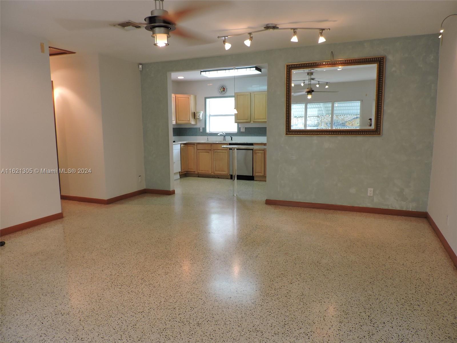 1630 Tyler Street Hollywood, FL 33020 - Photo 24 of 26 a view of a kitchen with a sink and a refrigerator