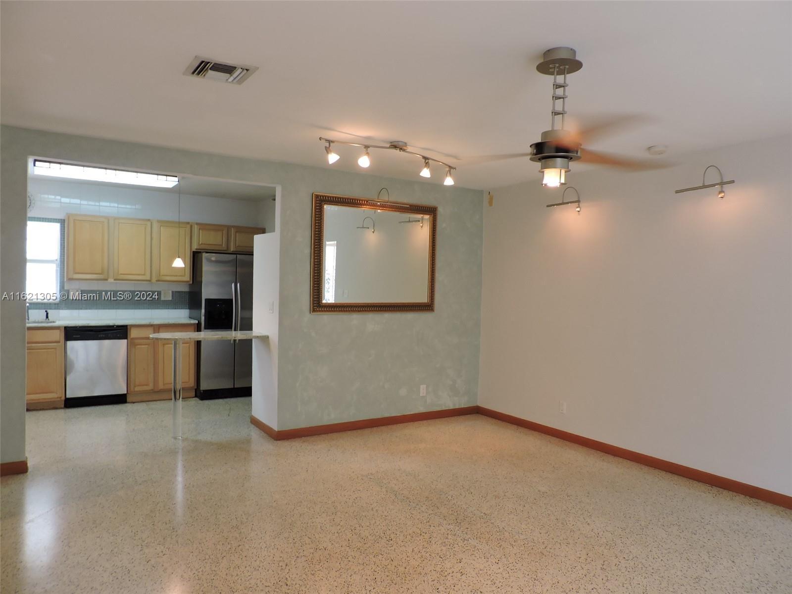 1630 Tyler Street Hollywood, FL 33020 - Photo 25 of 26 an empty room with a kitchen and a sink
