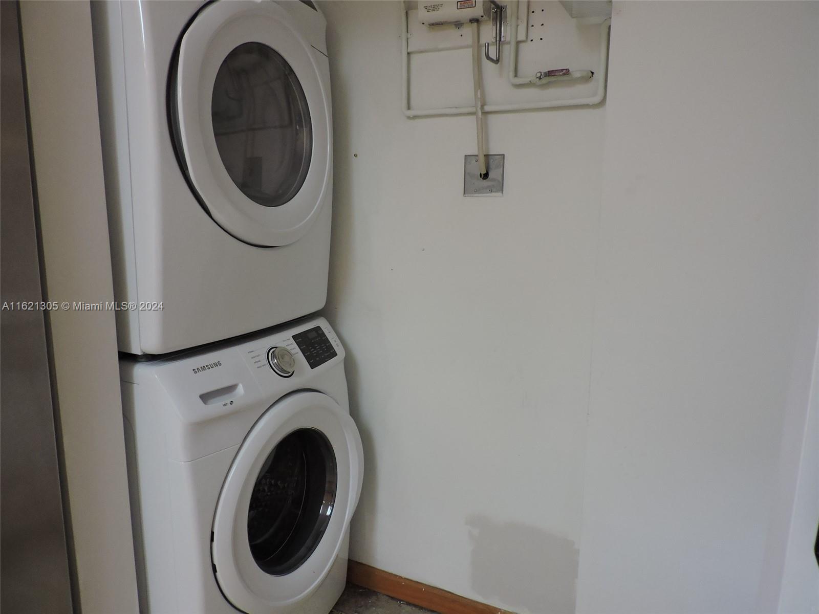 1630 Tyler Street Hollywood, FL 33020 - Photo 9 of 26 a utility room with dryer and washer