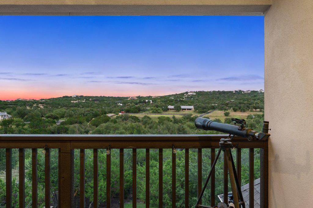 215 Lodestone Lane Austin, TX 78738 - Photo 29 of 40 Breathtaking hillside panoramas provide an idyllic backdrop for this balcony retreat.