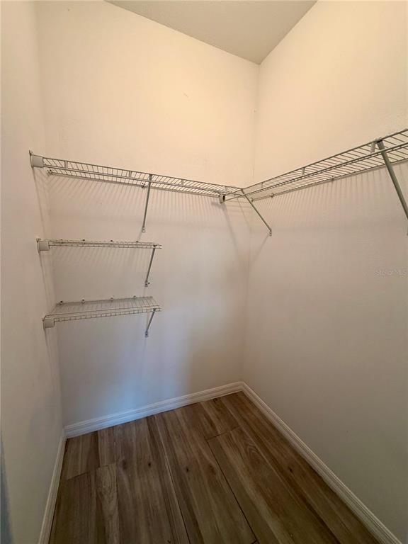 14142 Appleton Boulevard Port Charlotte, FL 33981 - Photo 7 of 26 a view of a room with racks on the wall
