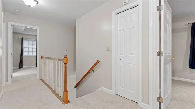 a view of a hallway with closet