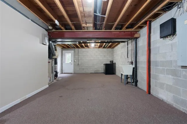 a view of empty room with wooden walls