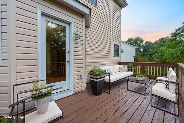 a view of a deck with furniture