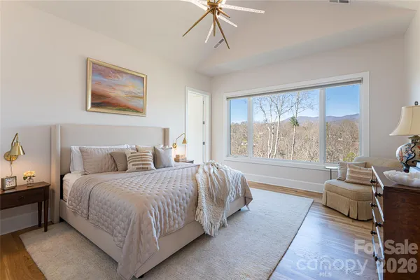 a bed room with a bed and a couch