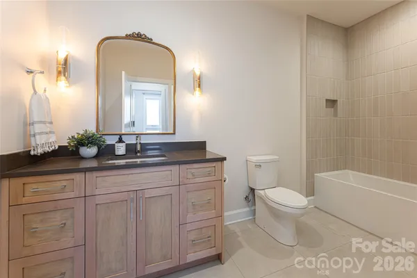 a bathroom with a toilet a sink and bathtub