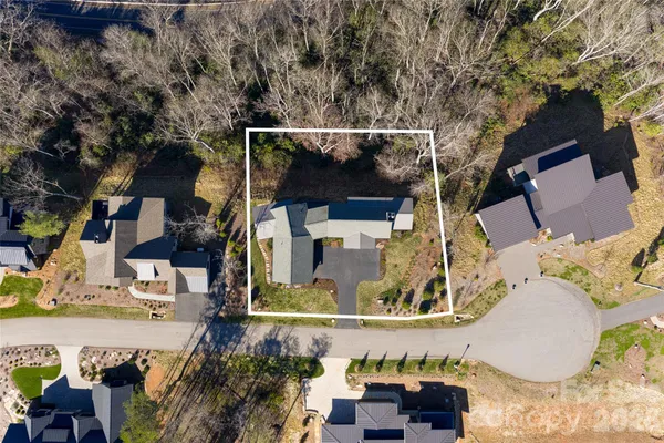 an aerial view of a house with outdoor space
