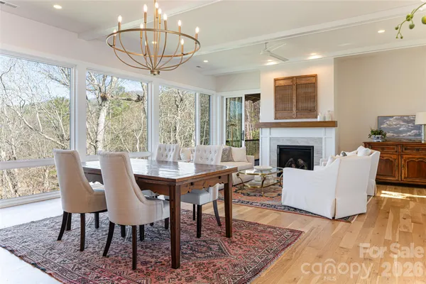 a view of a livingroom with furniture window and wooden floor