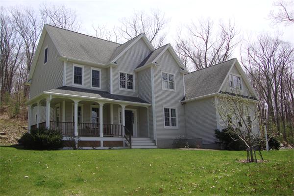 169 Manchaug Road Sutton, MA 01590 - Photo 1 of 30 a view of a house with a yard and a large tree