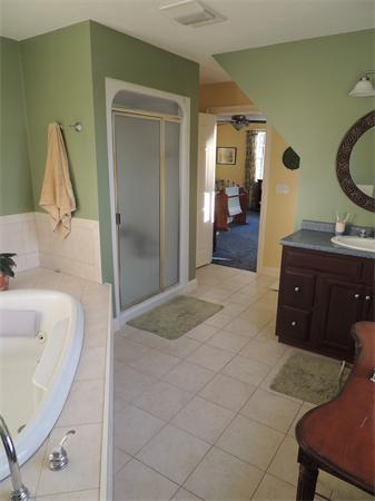 169 Manchaug Road Sutton, MA 01590 - Photo 15 of 30 a en suite bathroom with a sink and mirror