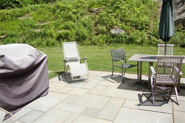 169 Manchaug Road Sutton, MA 01590 - Photo 27 of 30 a view of a chairs and table in patio with a fire pit