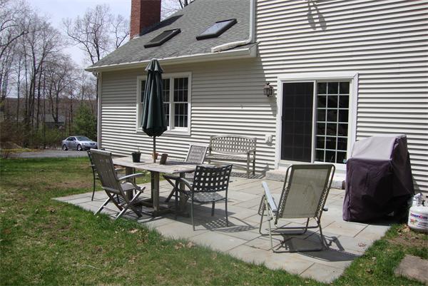 169 Manchaug Road Sutton, MA 01590 - Photo 28 of 30 a view of a house with backyard and sitting area