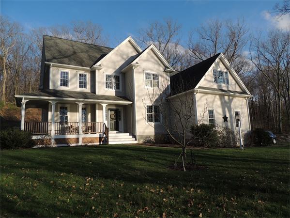 169 Manchaug Road Sutton, MA 01590 - Photo 29 of 30 a front view of a house with a yard