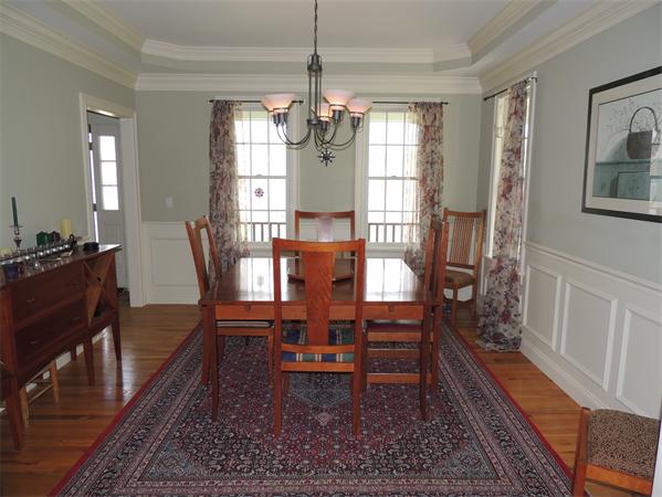 169 Manchaug Road Sutton, MA 01590 - Photo 4 of 30 a dining room with wooden floor and large windows