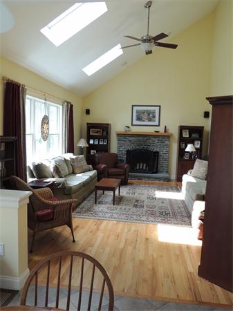 169 Manchaug Road Sutton, MA 01590 - Photo 7 of 30 a living room with furniture and a fireplace