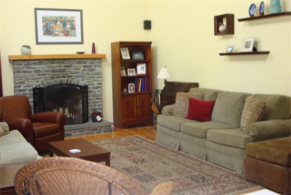 169 Manchaug Road Sutton, MA 01590 - Photo 8 of 30 a living room with furniture and a fireplace