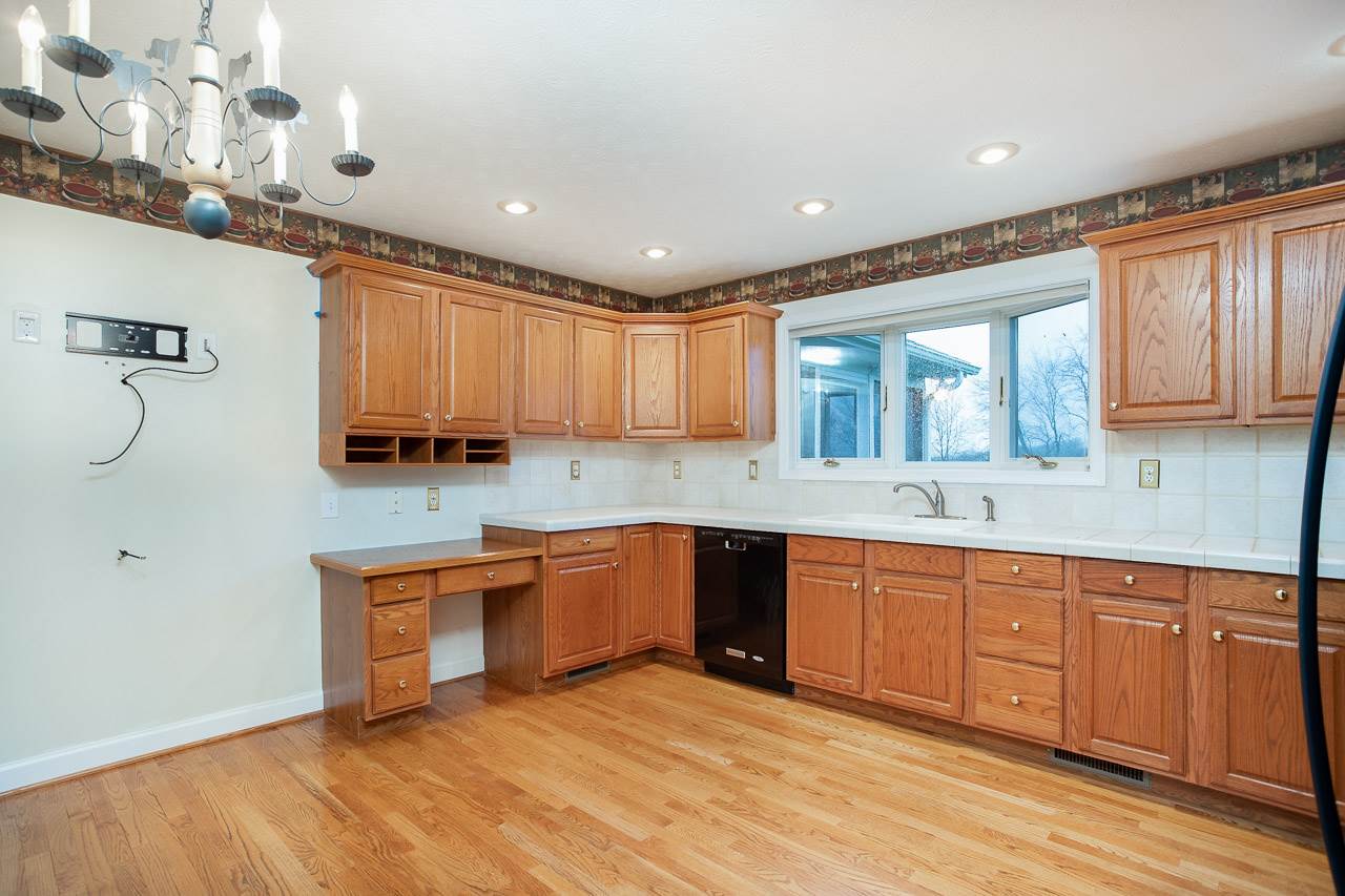 38 Spottswood Road Raphine, VA 24472 - Photo 2 of 40 a large kitchen with stainless steel appliances granite countertop a sink and cabinets