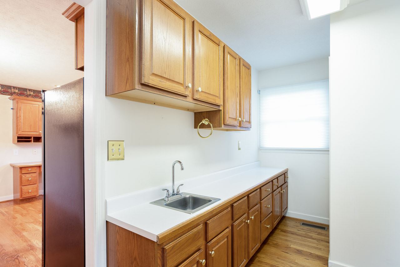 38 Spottswood Road Raphine, VA 24472 - Photo 21 of 40 a kitchen with stainless steel appliances granite countertop a sink and a wooden cabinets