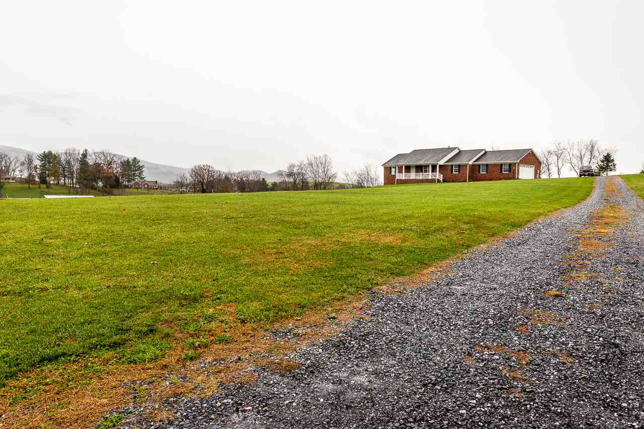 38 Spottswood Road Raphine, VA 24472 - Photo 27 of 40 a view of a green field with house in the background