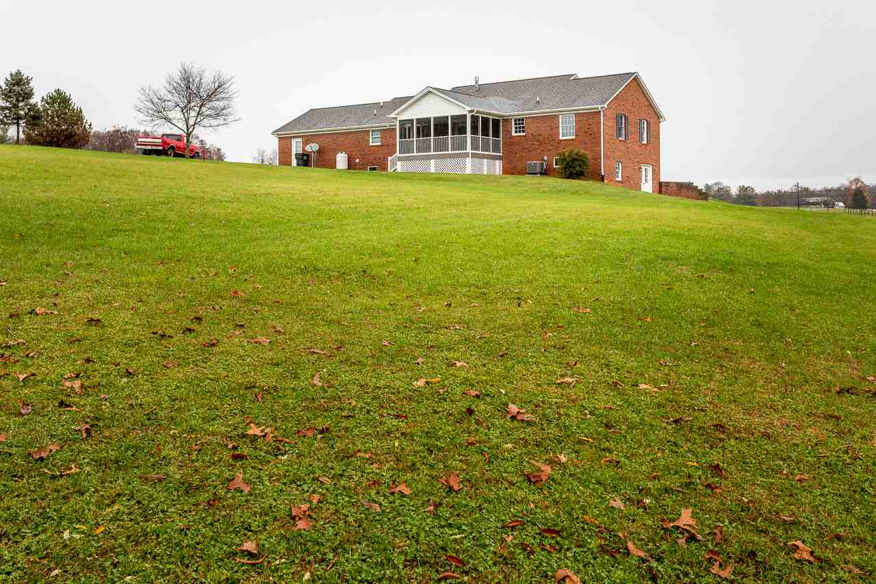 38 Spottswood Road Raphine, VA 24472 - Photo 34 of 40 a front view of house with yard and trees in the background