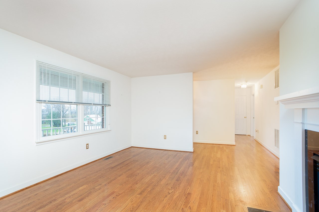 38 Spottswood Road Raphine, VA 24472 - Photo 8 of 40 an empty room with wooden floor and windows