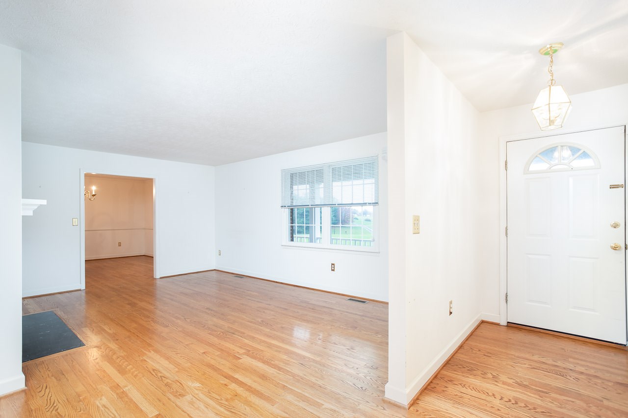 38 Spottswood Road Raphine, VA 24472 - Photo 9 of 40 a view of an empty room with wooden floor and a window