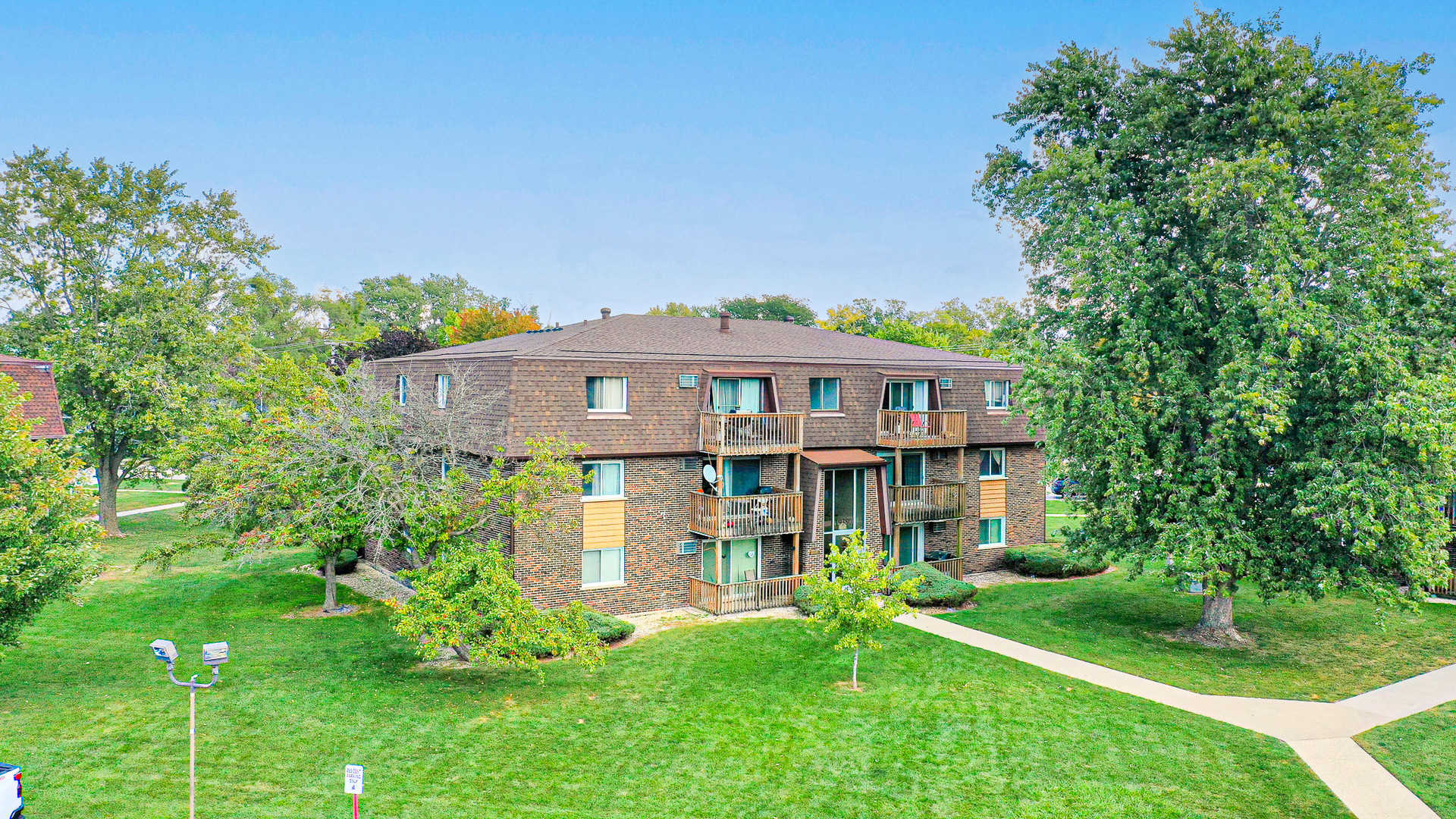 19380 Wolf Road, Unit 6 Mokena, IL 60448 - Photo 16 of 27 a front view of a house with a yard
