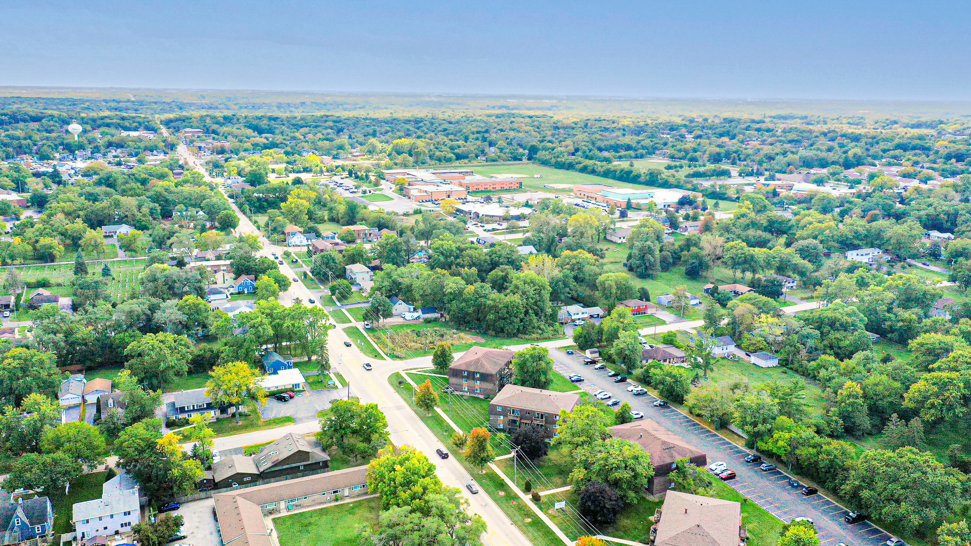 19380 Wolf Road, Unit 6 Mokena, IL 60448 - Photo 22 of 27 an aerial view of residential houses with outdoor space and trees