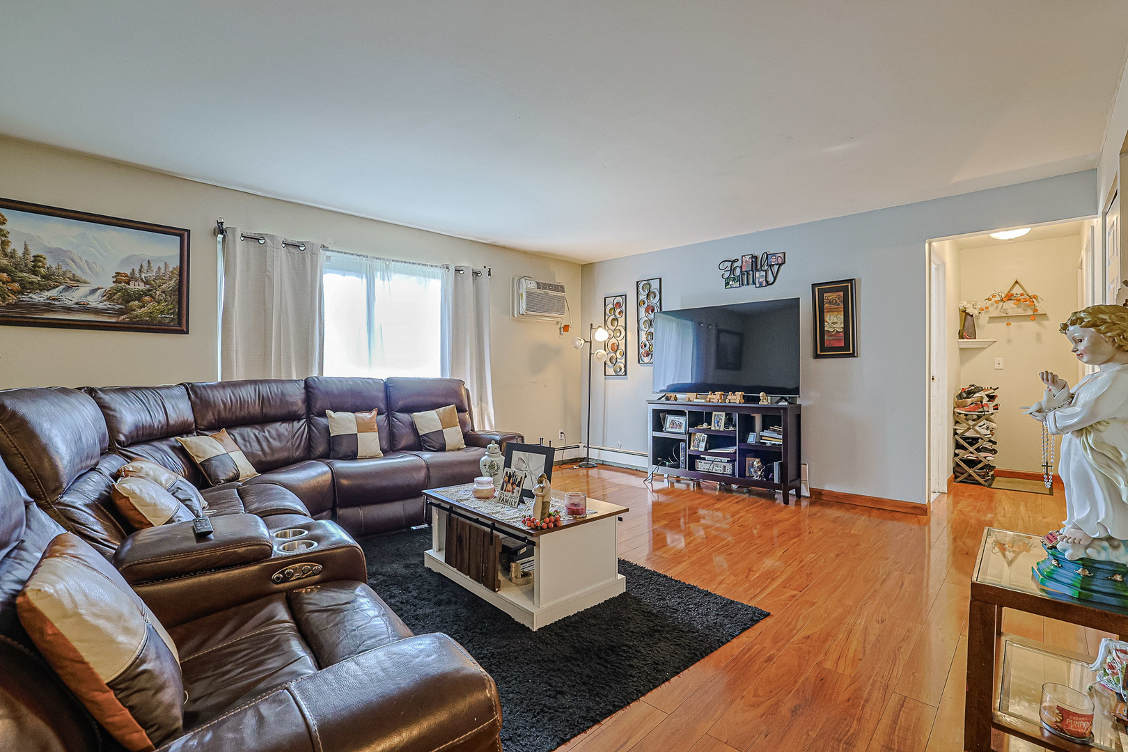 19380 Wolf Road, Unit 6 Mokena, IL 60448 - Photo 5 of 27 a living room with furniture and a flat screen tv