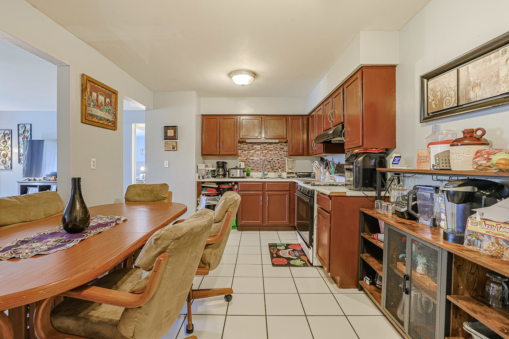 19380 Wolf Road, Unit 6 Mokena, IL 60448 - Photo 10 of 27 a kitchen with stainless steel appliances kitchen island granite countertop a sink and cabinets