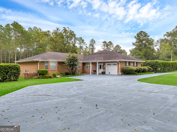 an aerial view of residential house with outdoor space and lake view