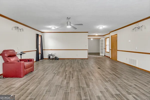 a view of a backyard with a wooden fence