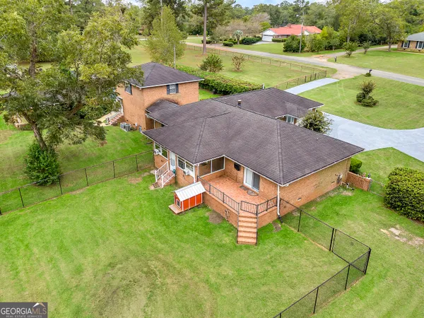 a view of a house with a yard porch and sitting area
