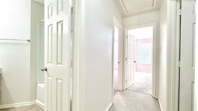 a view of a bathroom with a shower and a door