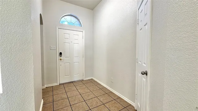 a view of a hallway to rooms