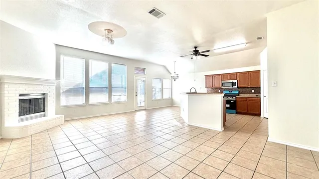 a view of a kitchen with a sink and a stove top oven