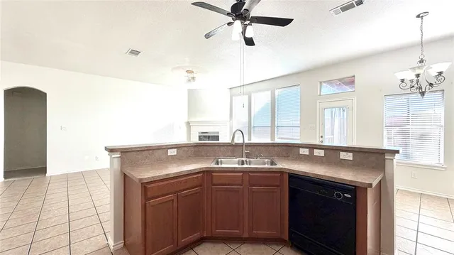 a kitchen with a sink and a window