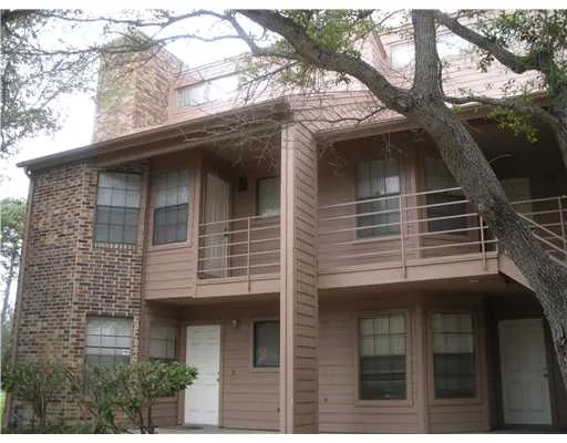 a view of house with a tree