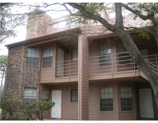 a view of house with a tree
