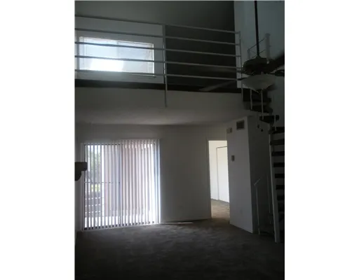 a view of empty room with windows