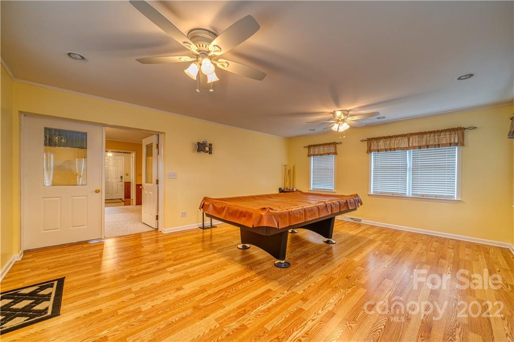 740 Rainey Road Salisbury, NC 28146 - Photo 14 of 32 a room with pool table and wooden floor