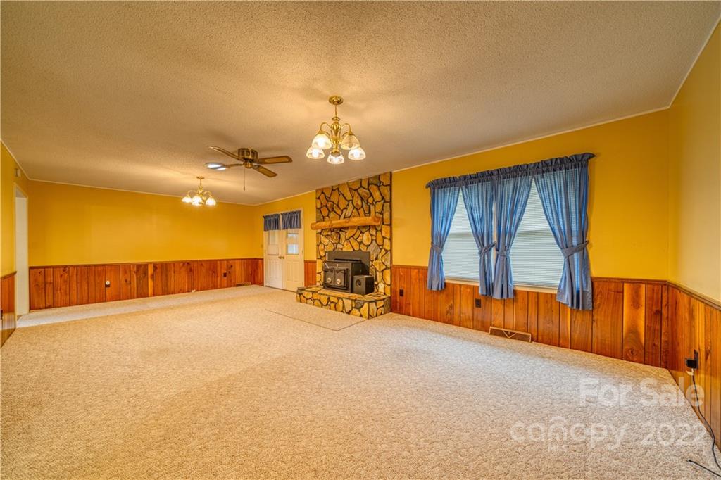 740 Rainey Road Salisbury, NC 28146 - Photo 17 of 32 a view of a livingroom with furniture and a chandelier