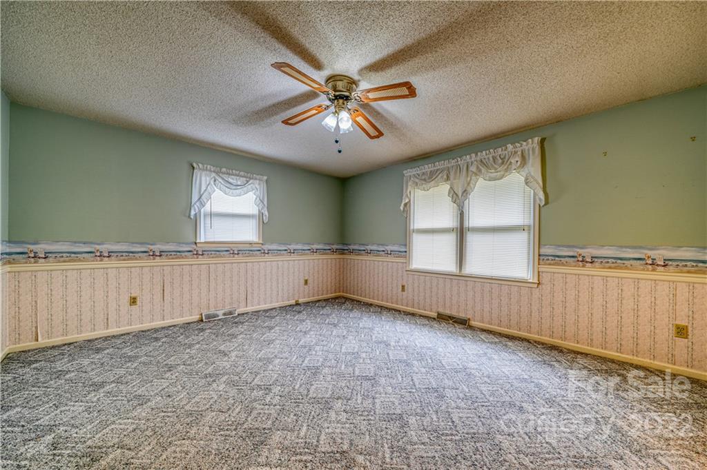 740 Rainey Road Salisbury, NC 28146 - Photo 19 of 32 wooden floor in an empty room with a window