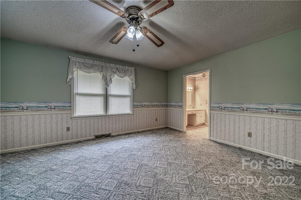 740 Rainey Road Salisbury, NC 28146 - Photo 20 of 32 an empty room with windows