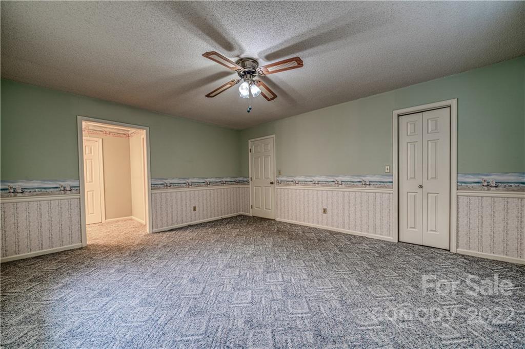 740 Rainey Road Salisbury, NC 28146 - Photo 21 of 32 a view of an empty room and kitchen view