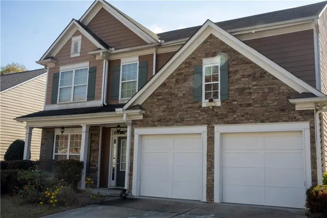 a view of a house with garage