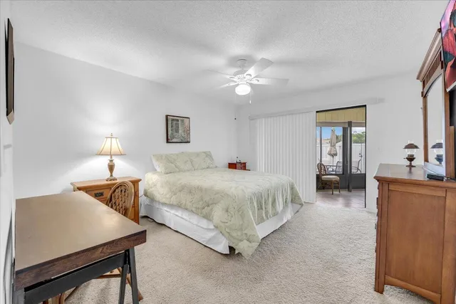 a spacious bedroom with a bed and window