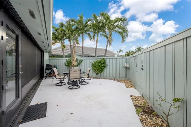 a view of a bench with potted plants